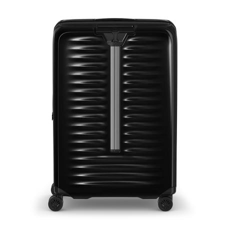 Black hardshell rolling suitcase with horizontal ridges and a telescoping handle.