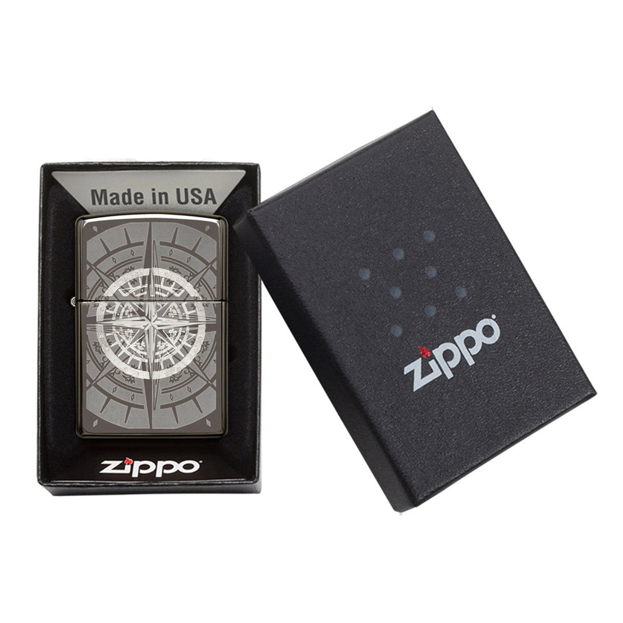 Zippo lighter with a compass design engraved on its surface, displayed in its packaging.