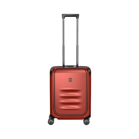 Red hardshell rolling suitcase with a telescoping handle and wheels.