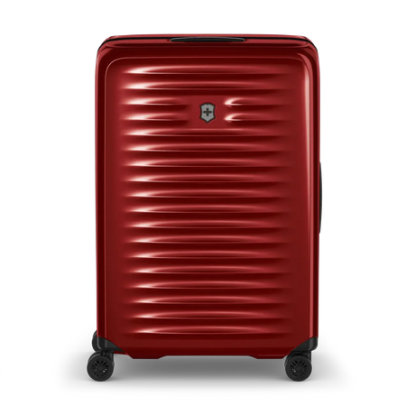 Red hardshell rolling suitcase with horizontal ridges and a logo.