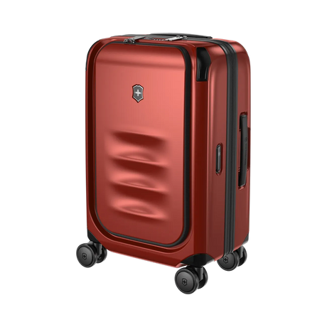 Red hardshell rolling suitcase with four wheels and a front pocket.