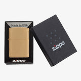 Gold-colored Zippo lighter with its packaging box.
