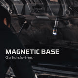 Magnetic flashlight attached to the underside of a vehicle.