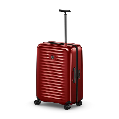 Red hardshell rolling suitcase with horizontal ridges and an extendable handle.