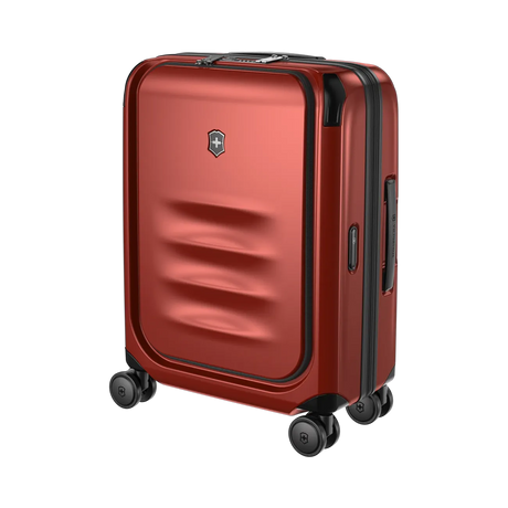 Red hardshell rolling suitcase with horizontal ridges on the front panel.