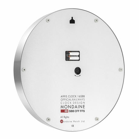 Circular white clock face with minimal markings and a Mondaine logo.
