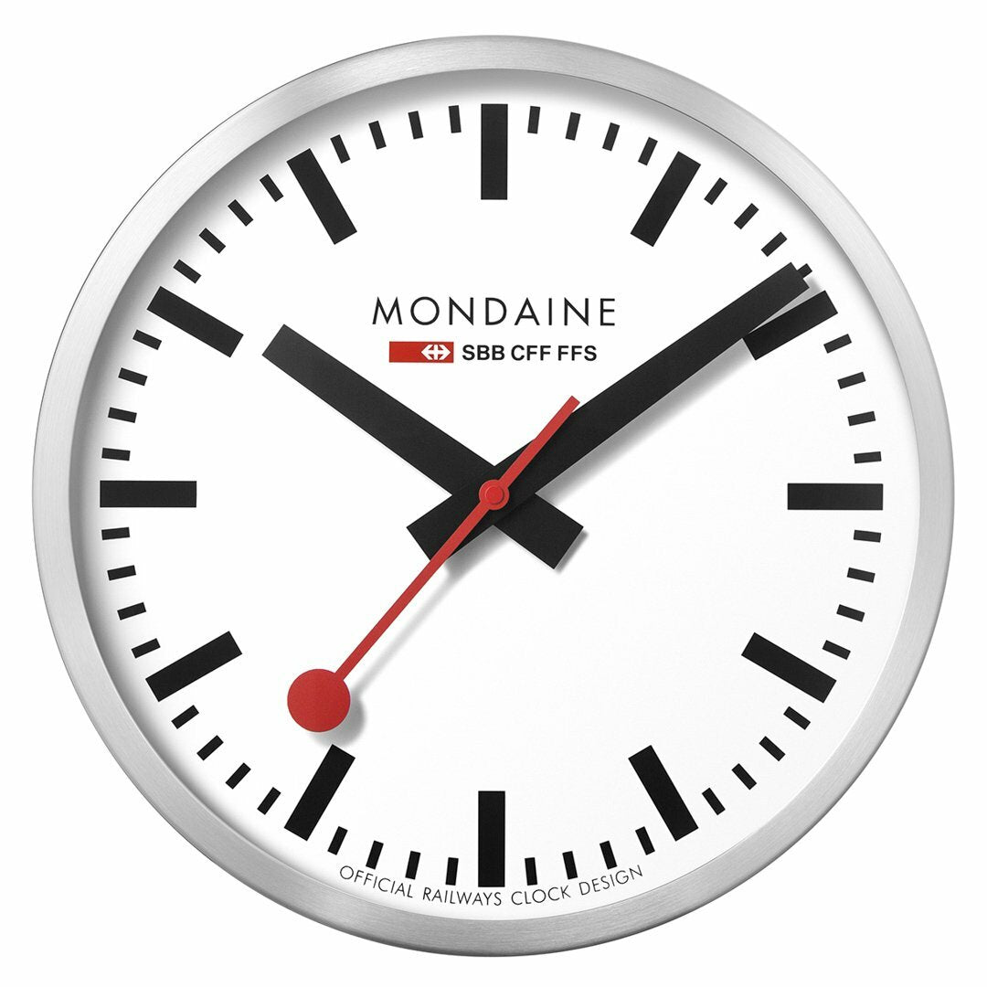 Classic Swiss railway clock with a white face, black markings, and red hands.