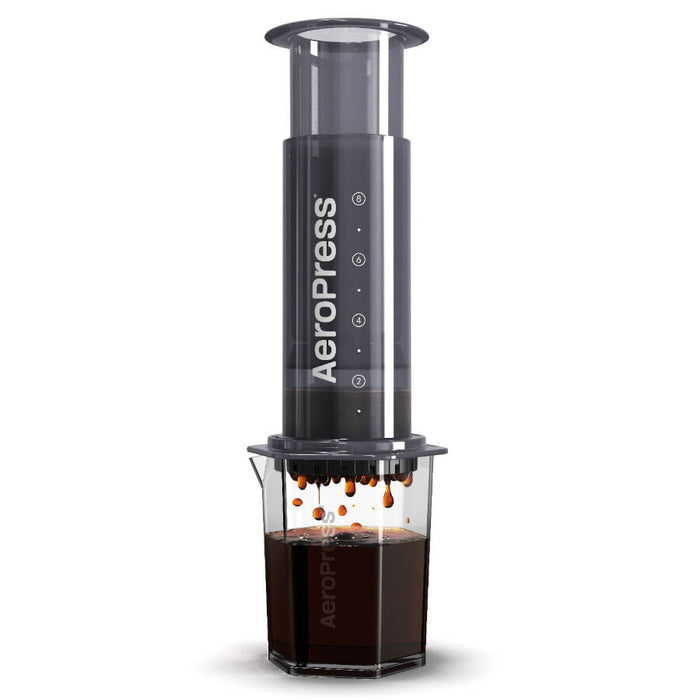 AeroPress coffee maker with a clear chamber containing brewed coffee.