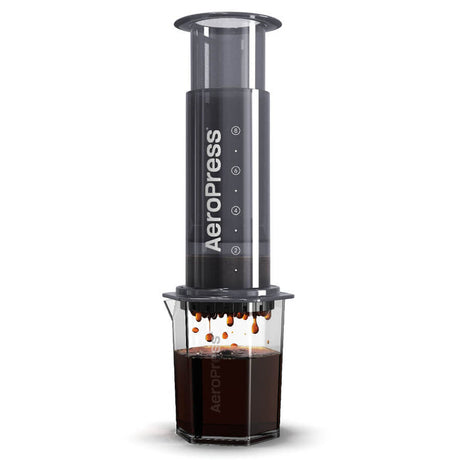 AeroPress coffee maker with a clear chamber containing brewed coffee.