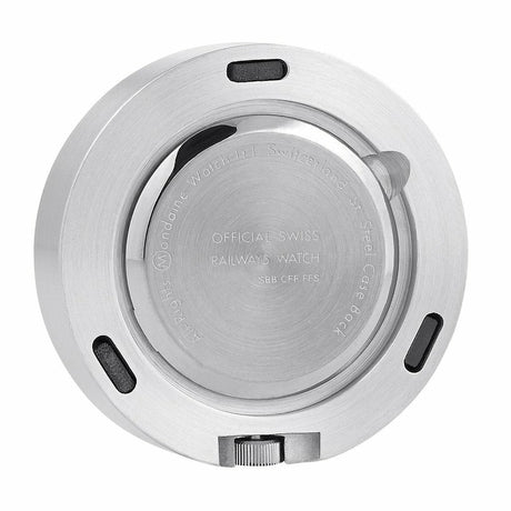 Circular metal watch case back with engraved text and notches.